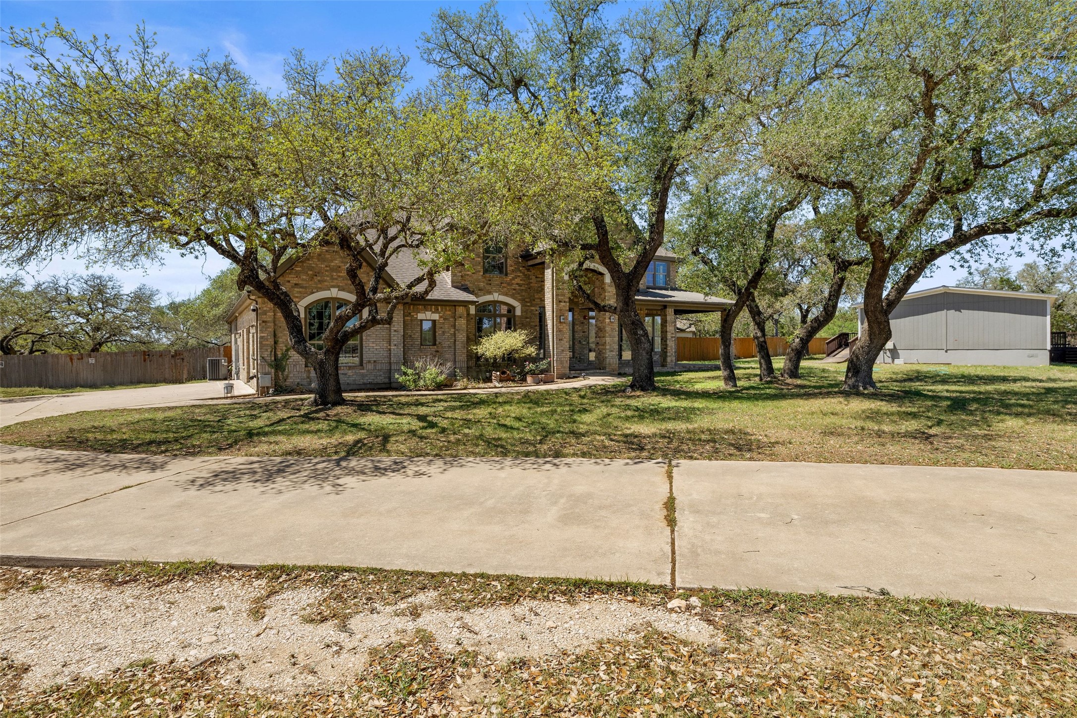 815 Elliott Ranch Road Buda, TX 78610 - Photo 33 of 40 View of front facade featuring brick siding and a porch
