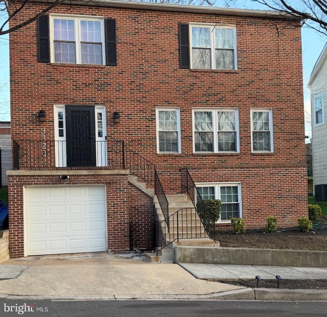Charming brick home with inviting steps.