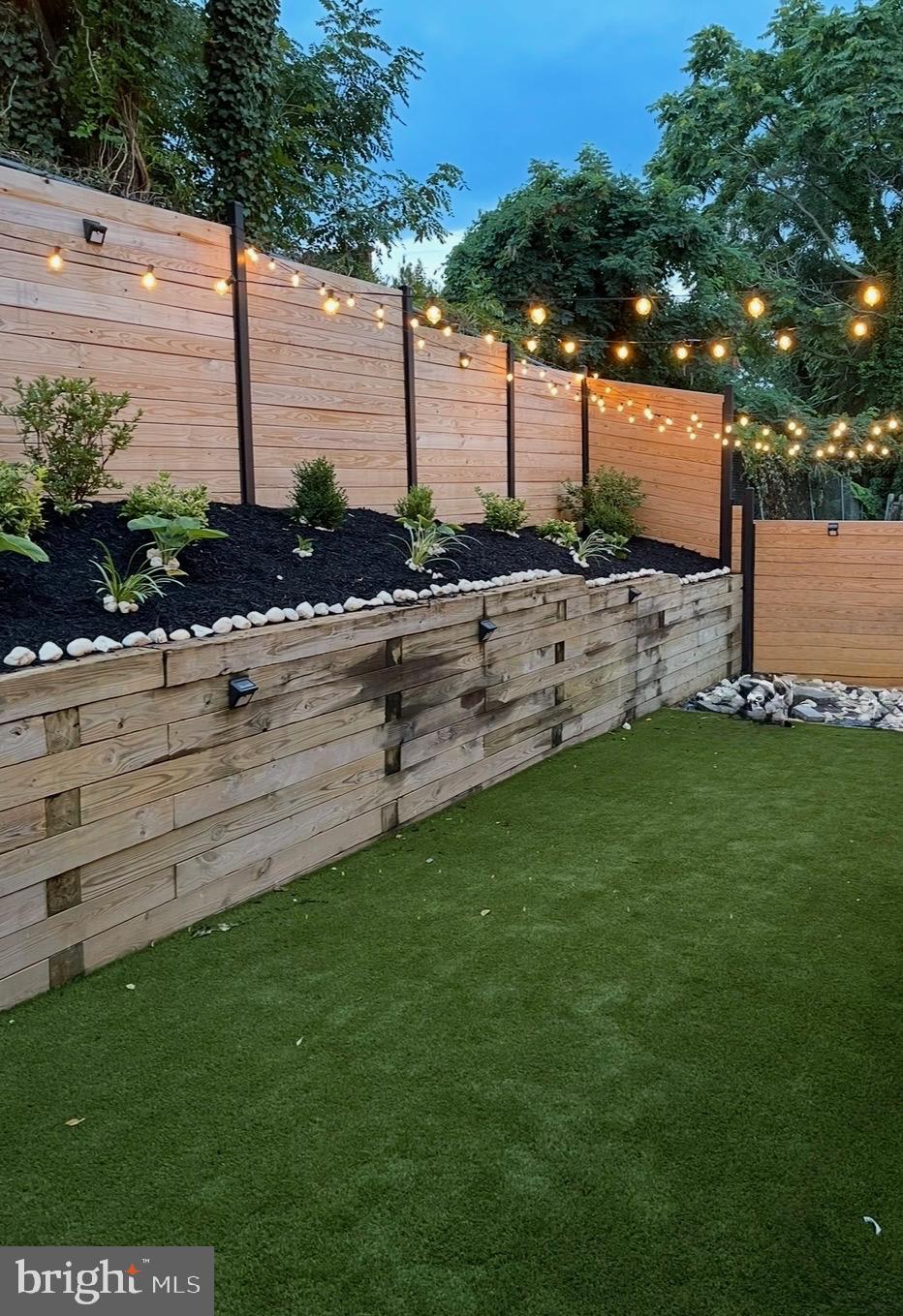 3320 Oxon Run Road Southeast Washington, DC 20032 - Photo 2 of 2 Charming garden oasis with twinkling lights.