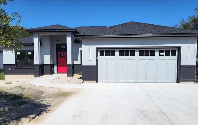 a view of a house with a snow in the background