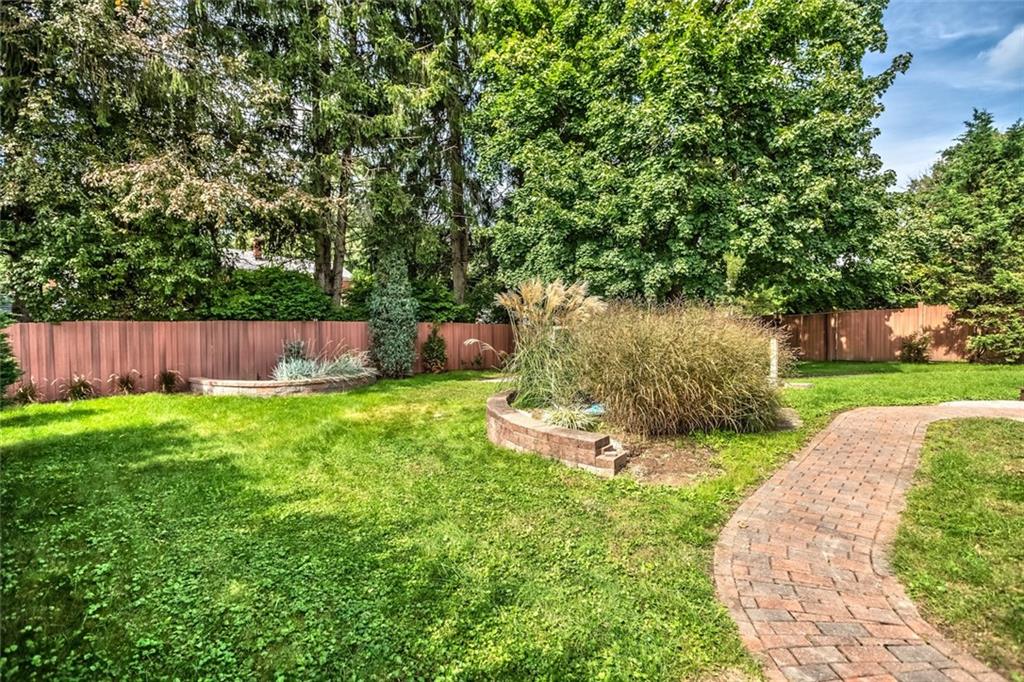 9101 Pannier Road Pittsburgh, PA 15237 - Photo 5 of 24 LEVEL Fenced rear yard with deck and omni stone patio & Utility shed.