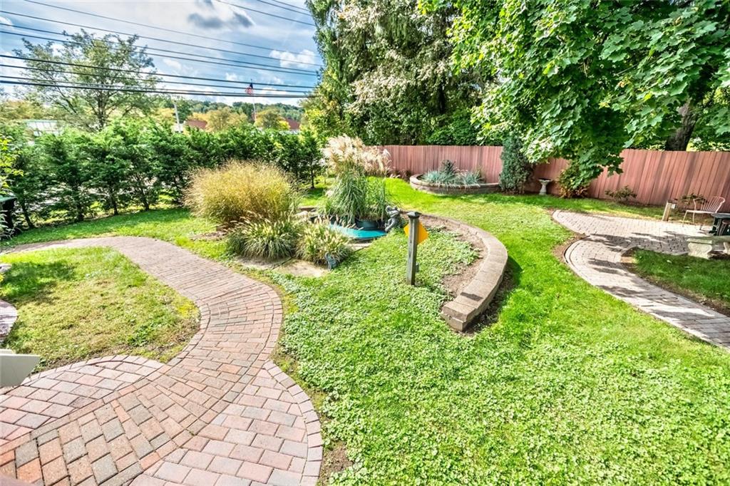 9101 Pannier Road Pittsburgh, PA 15237 - Photo 9 of 24 LEVEL Fenced rear yard with deck and omni stone patio & Utility shed.