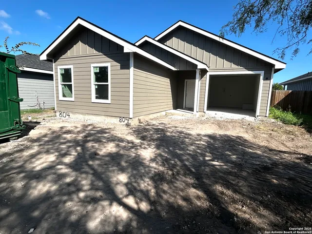a front view of a house with yard
