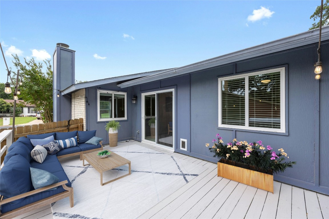 a house view with a seating space and garden space