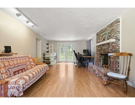 71 Thomas Street Ashland, MA 01721 - Photo 15 of 36 a living room with furniture and a fireplace