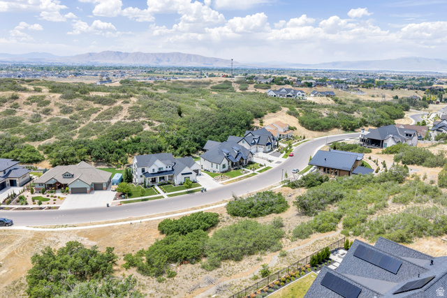 3383 South Mapleton Estates Drive, Unit 18 Mapleton, UT 84664 - Photo 7 of 11 Expansive residential development featuring modern and traditional architectural styles, surrounded by natural terrain and distant mountains