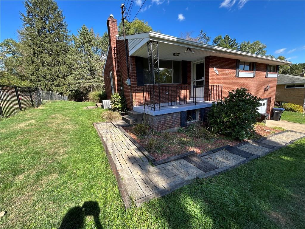 423 Sharon Road Coraopolis, PA 15108 - Photo 24 of 24 a front view of a house with garden