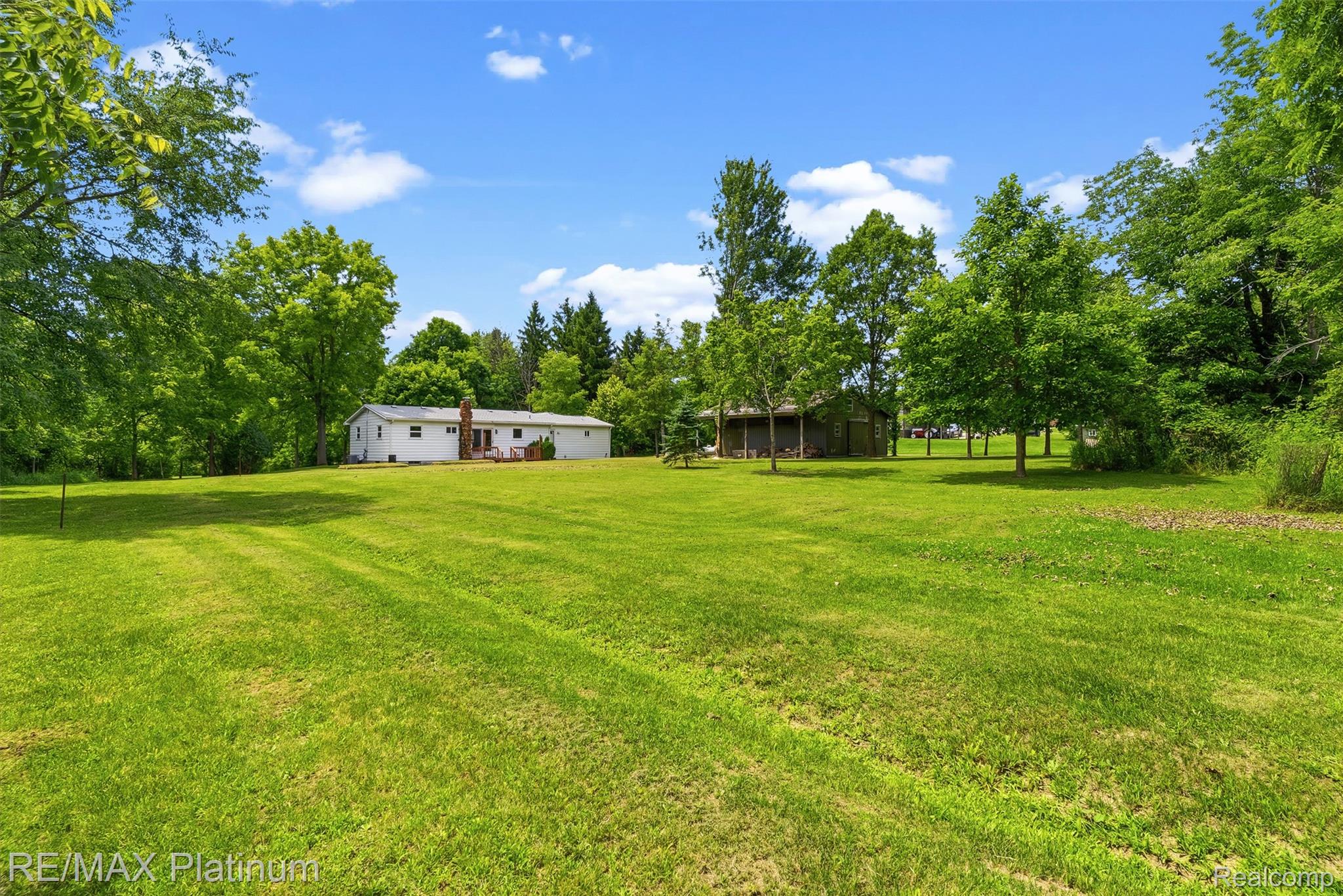8370 West Rolston Road Linden, MI 48451 - Photo 31 of 36 Expansive green lawn providing abundant outdoor space