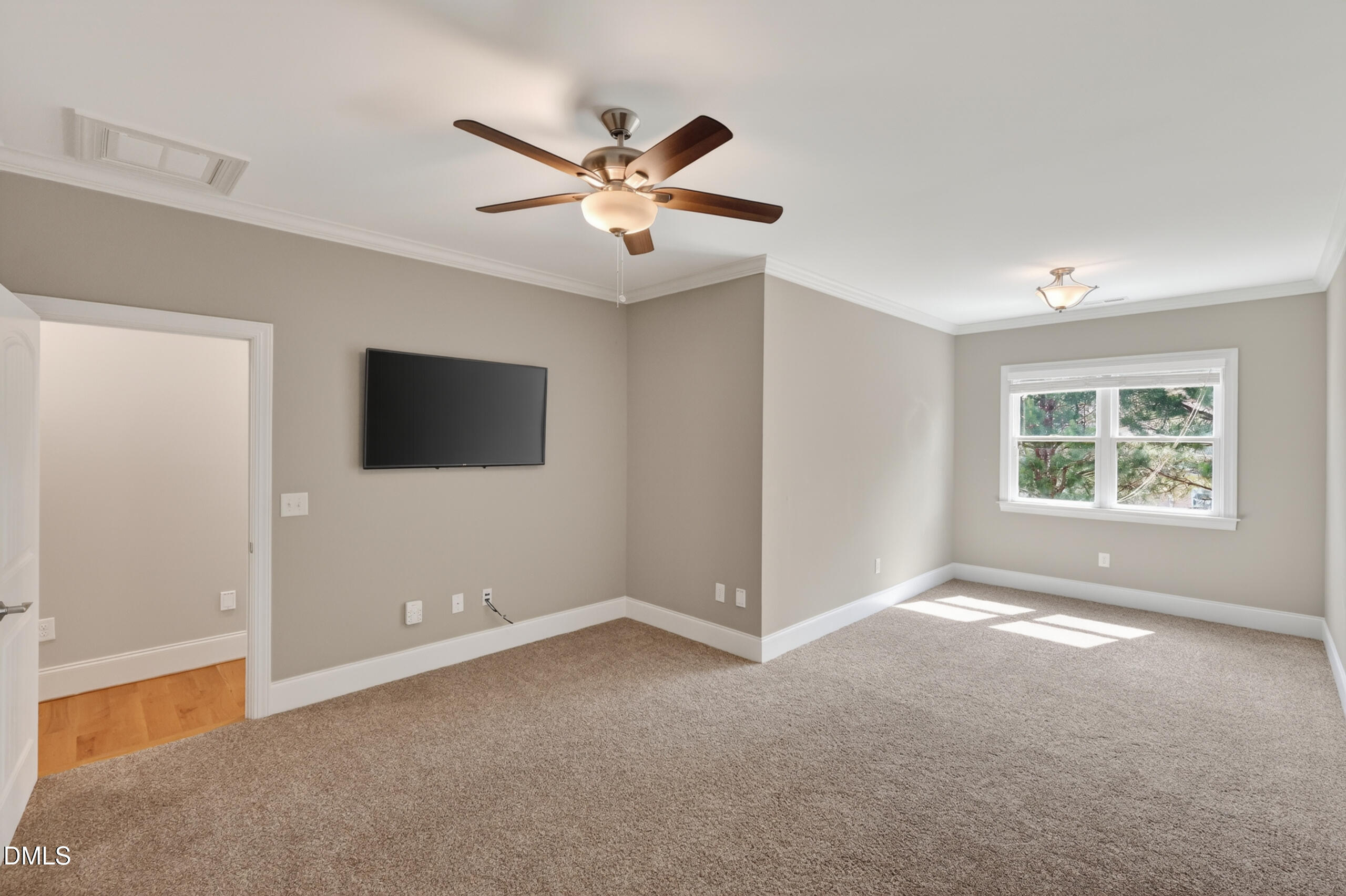261 Character Drive Rolesville, NC 27571 - Photo 48 of 77 a view of an empty room with window and chandelier fan