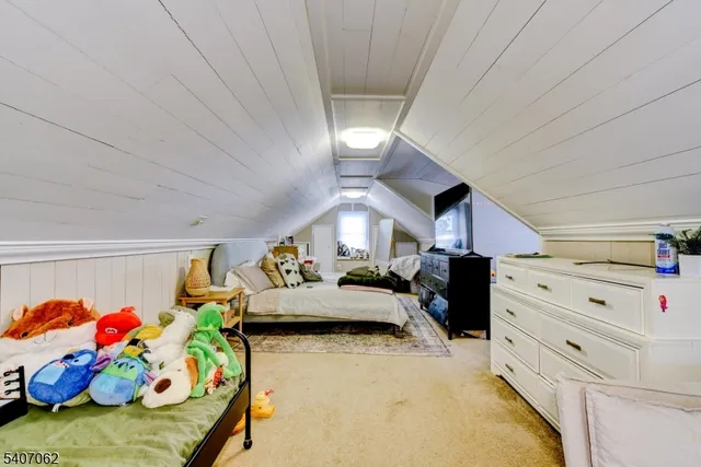 a bedroom with furniture and a baby crib