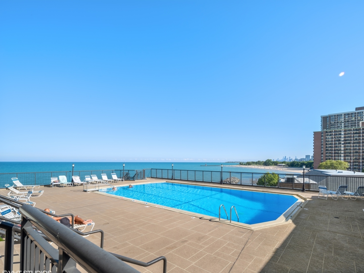 6007 North Sheridan Road, Unit 31F Chicago, IL 60660 - Photo 23 of 43 a view of a swimming pool and an outdoor seating