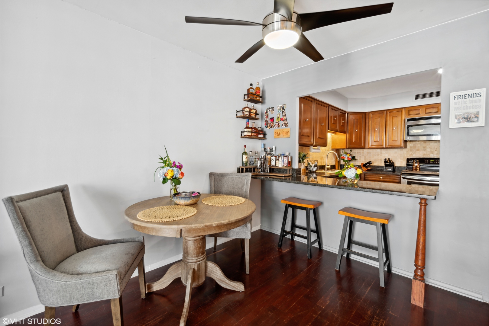 6007 North Sheridan Road, Unit 31F Chicago, IL 60660 - Photo 5 of 43 a view of a dining room with furniture window and wooden floor