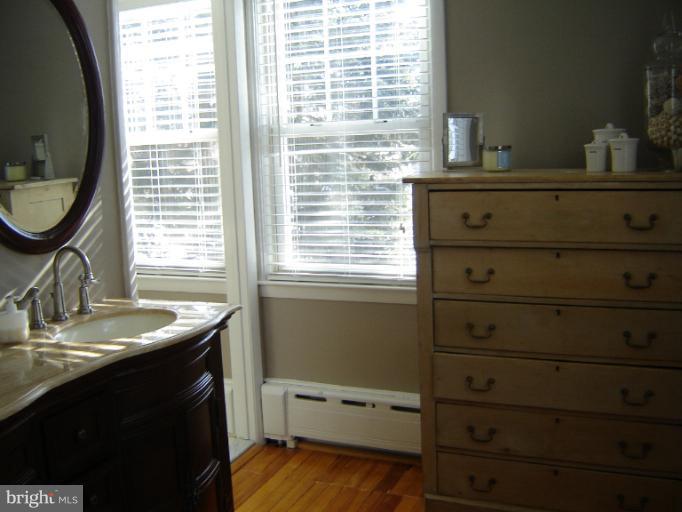 232 Ridgeway Road Catonsville, MD 21228 - Photo 14 of 30 a bathroom with a sink and a mirror