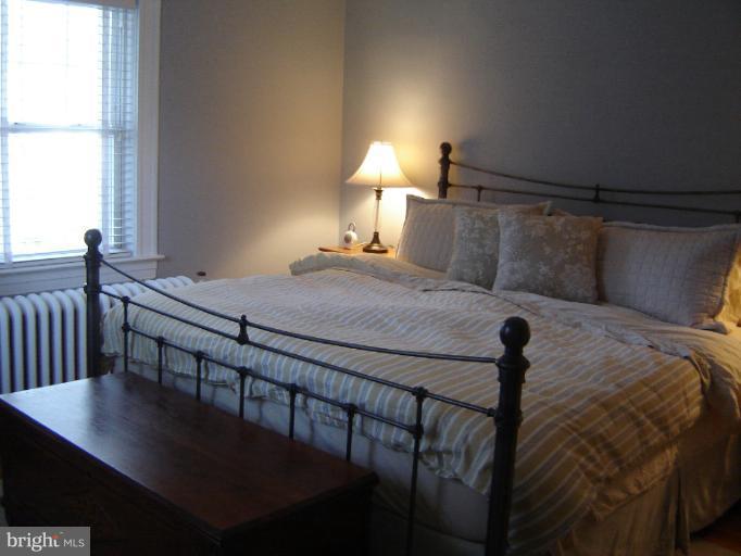 232 Ridgeway Road Catonsville, MD 21228 - Photo 22 of 30 a bedroom with a bed and a table