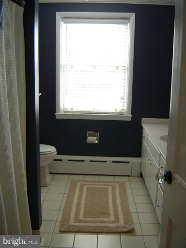 232 Ridgeway Road Catonsville, MD 21228 - Photo 23 of 30 a bathroom with a bathtub and window