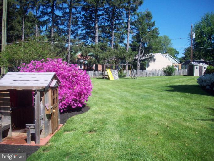 232 Ridgeway Road Catonsville, MD 21228 - Photo 29 of 30 a view of a house with a backyard and a patio