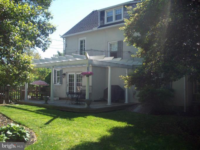 232 Ridgeway Road Catonsville, MD 21228 - Photo 7 of 30 a front view of a house with a yard table and chairs