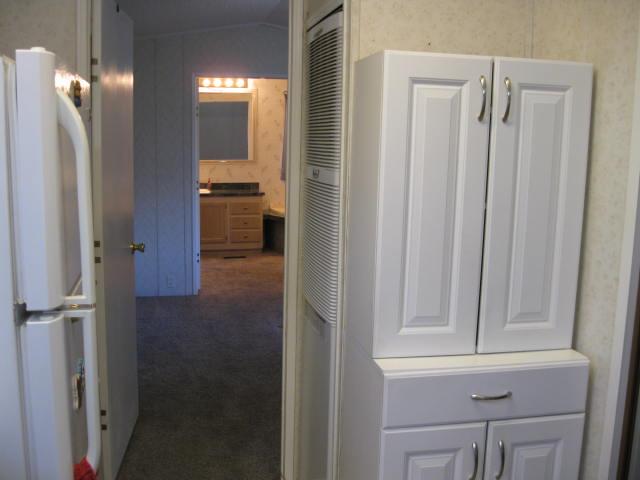 1270 Magic Sands Way Turlock, CA 95380 - Photo 11 of 25 a view of a kitchen from the hallway