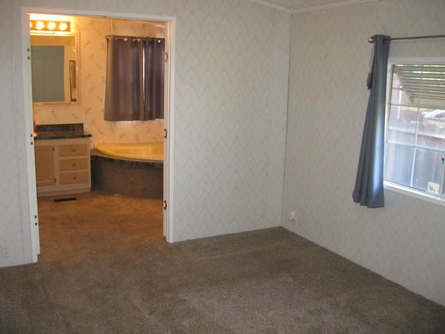 1270 Magic Sands Way Turlock, CA 95380 - Photo 12 of 25 a bathroom with a tub