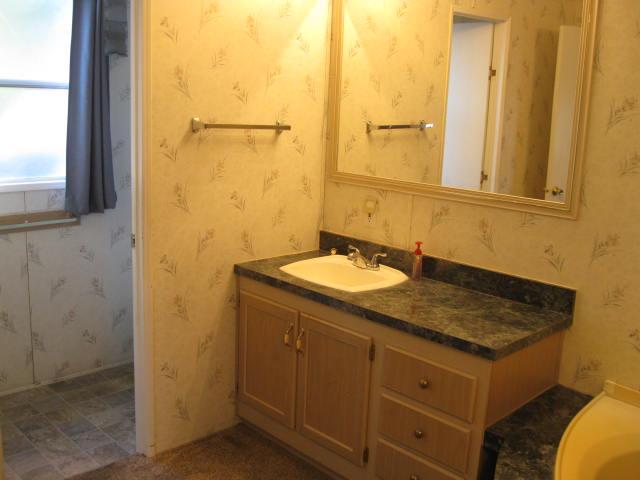 1270 Magic Sands Way Turlock, CA 95380 - Photo 15 of 25 a bathroom with a sink and a mirror
