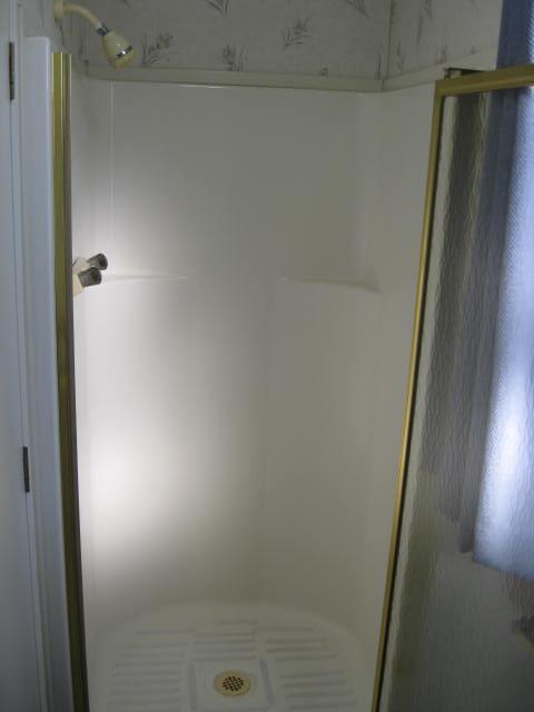 1270 Magic Sands Way Turlock, CA 95380 - Photo 16 of 25 a bathroom with a shower