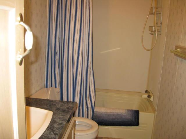 1270 Magic Sands Way Turlock, CA 95380 - Photo 18 of 25 a bathroom with a granite countertop sink toilet and shower