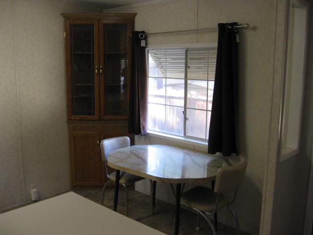 1270 Magic Sands Way Turlock, CA 95380 - Photo 6 of 25 a view of a room that has a table and chairs in it
