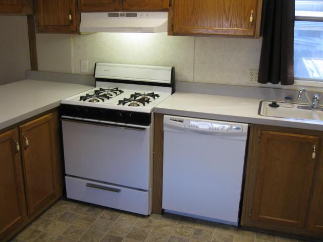 1270 Magic Sands Way Turlock, CA 95380 - Photo 9 of 25 a kitchen with a stove and a sink