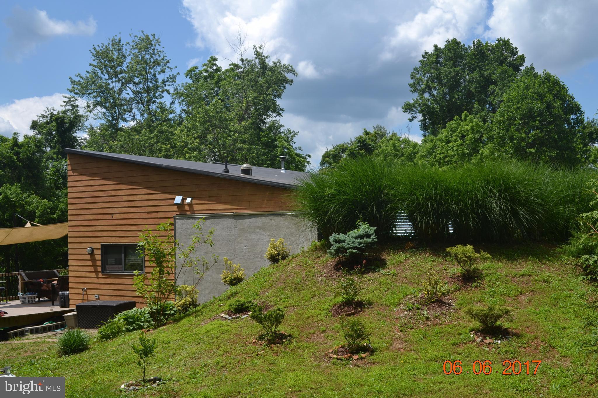 2612 Reckord Road Kingsville, MD 21087 - Photo 14 of 28 a backyard of a house with plants and large trees