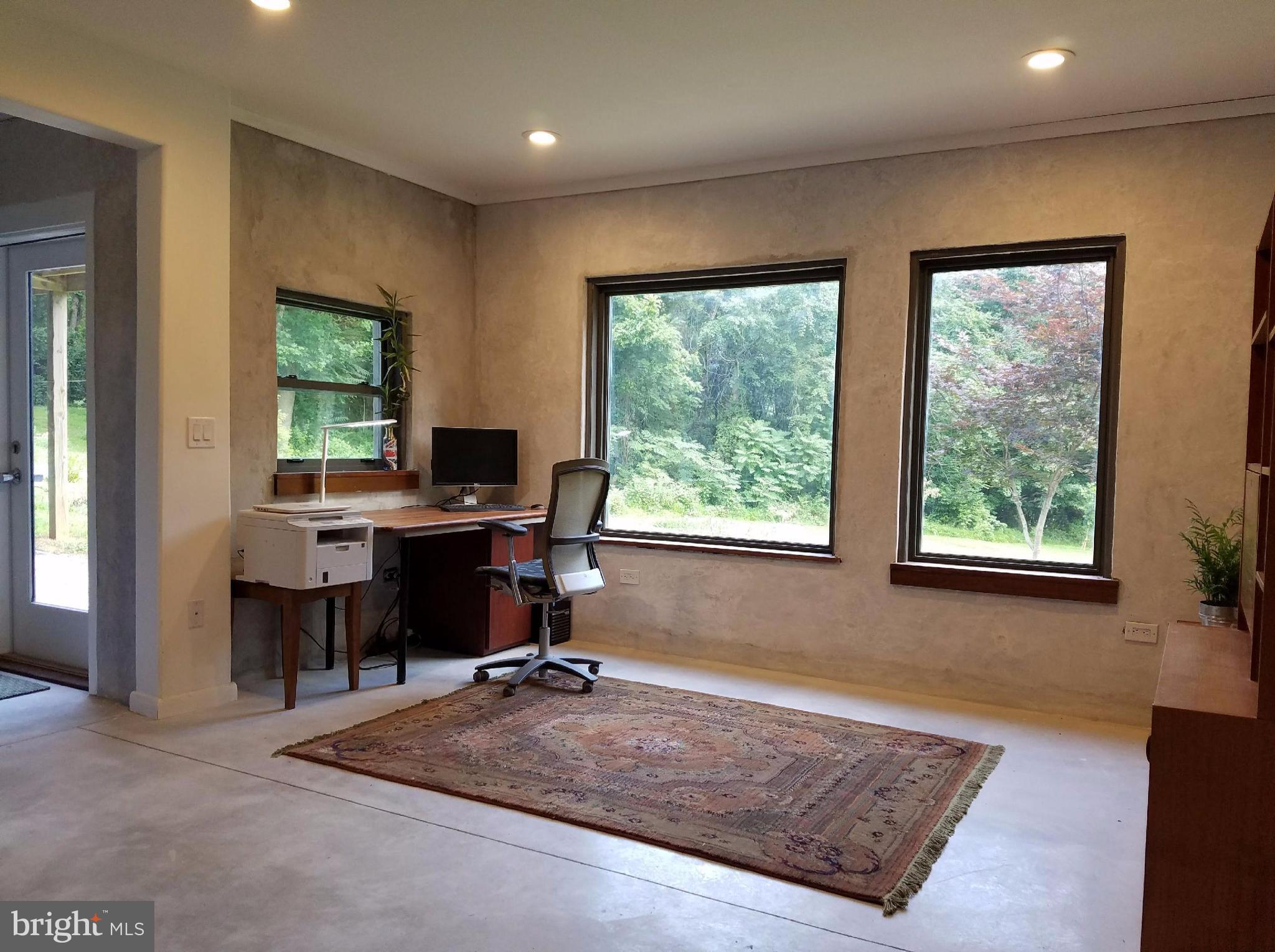 2612 Reckord Road Kingsville, MD 21087 - Photo 8 of 28 a view of a workspace with furniture and a window
