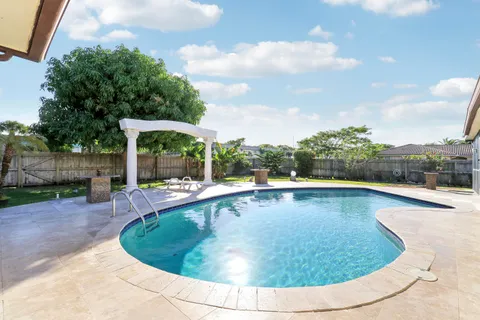 a view of outdoor space yard swimming pool and outdoor seating