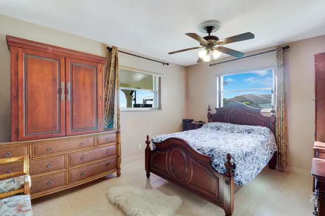 a kitchen with stainless steel appliances granite countertop a stove refrigerator and a sink