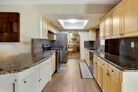 a large kitchen with cabinets