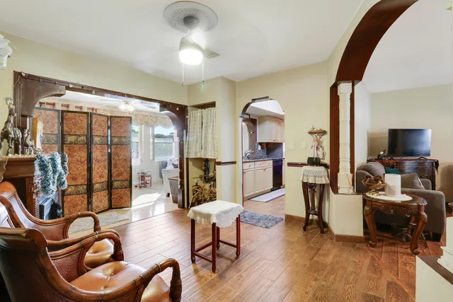 a living room with furniture and a potted plant