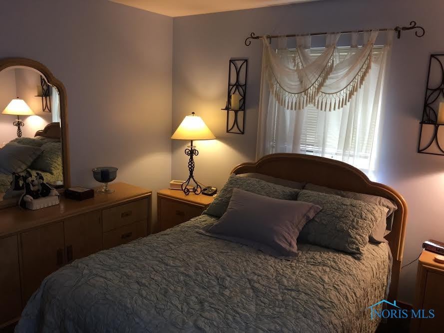 711 Ransom Street Maumee, OH 43537 - Photo 11 of 17 This first floor Master Bedroom is serene and the closet has an efficient closet system.