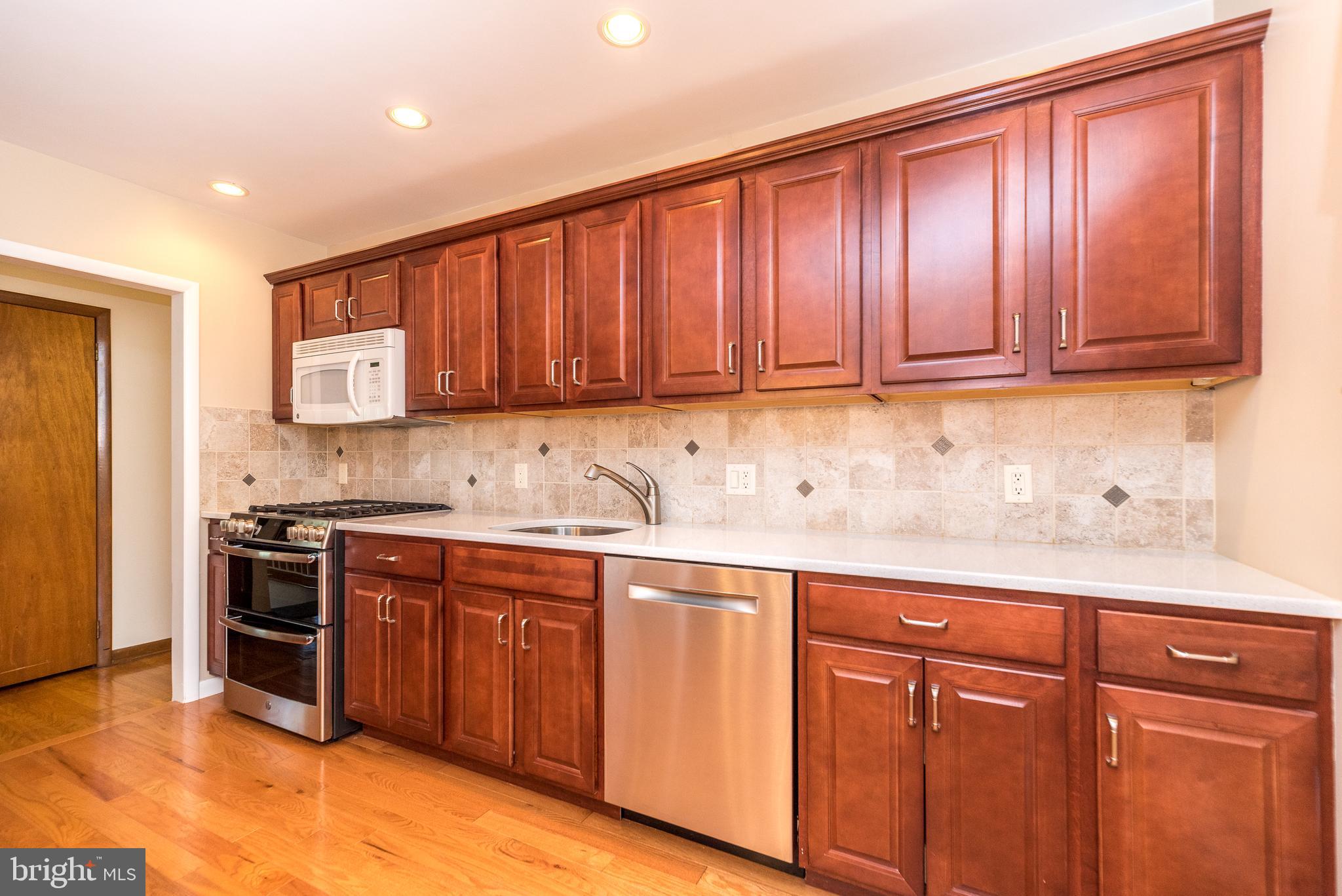 1624 Dogwood Road Flourtown, PA 19031 - Photo 7 of 22 Cherry cabinets and quartz countertops.
