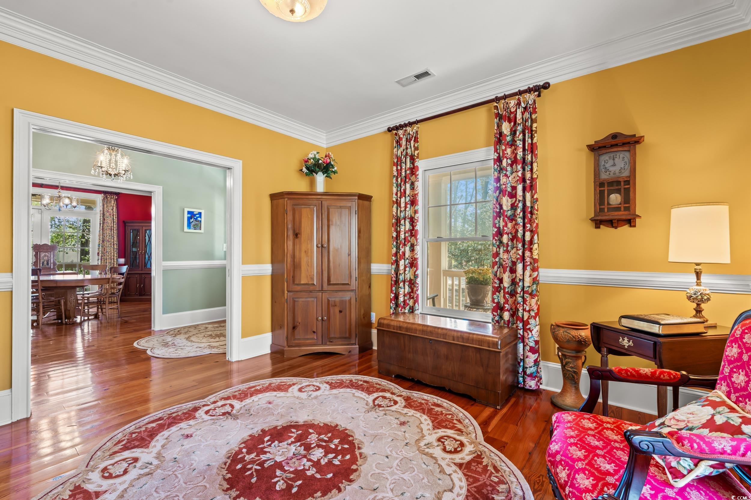 246 County Rd S-22-656 Murrells Inlet, SC 29576 - Photo 13 of 39 Reading parlor or living room with heart-pine floo
