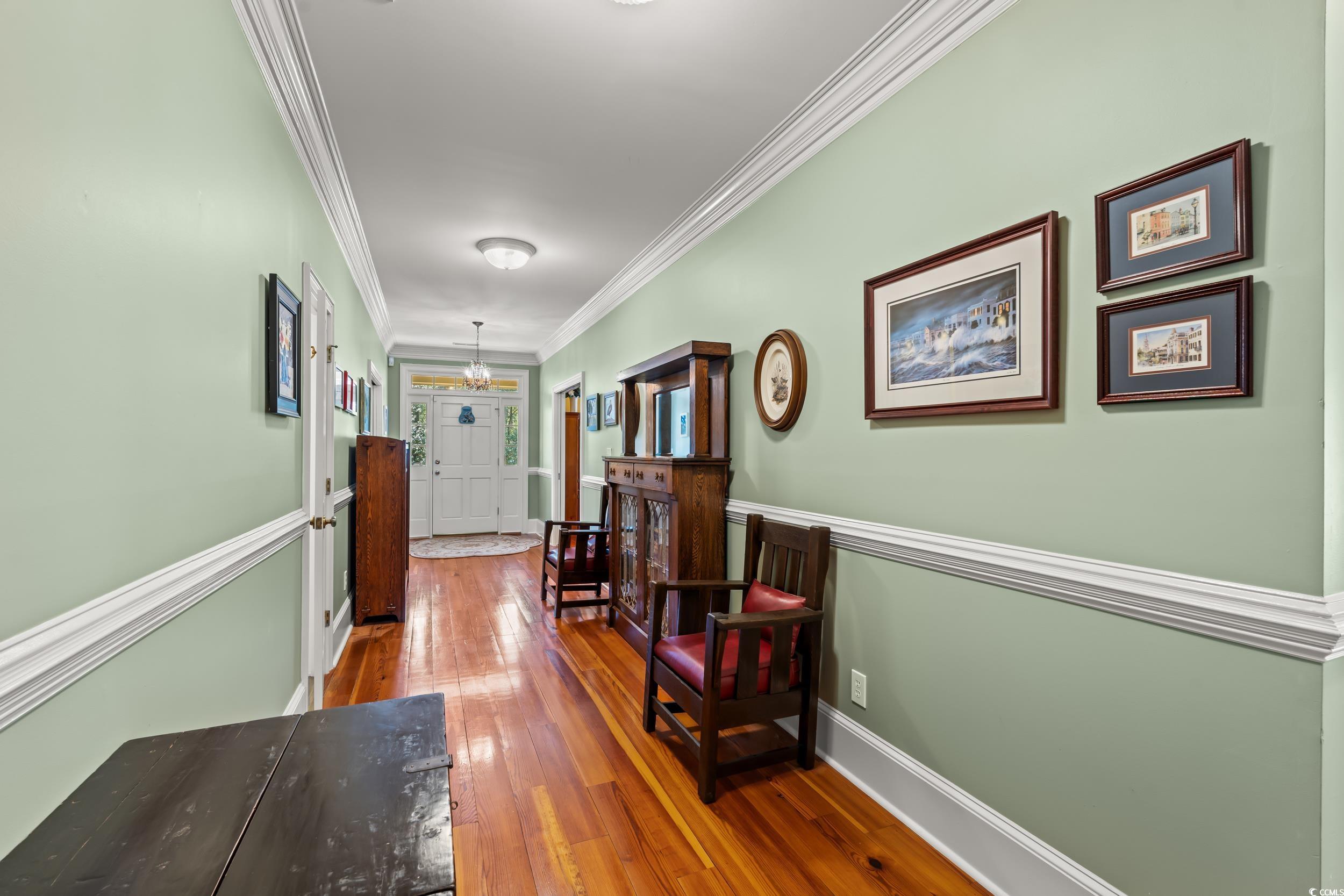 246 County Rd S-22-656 Murrells Inlet, SC 29576 - Photo 16 of 39 Corridor featuring baseboards, a notable chandelie