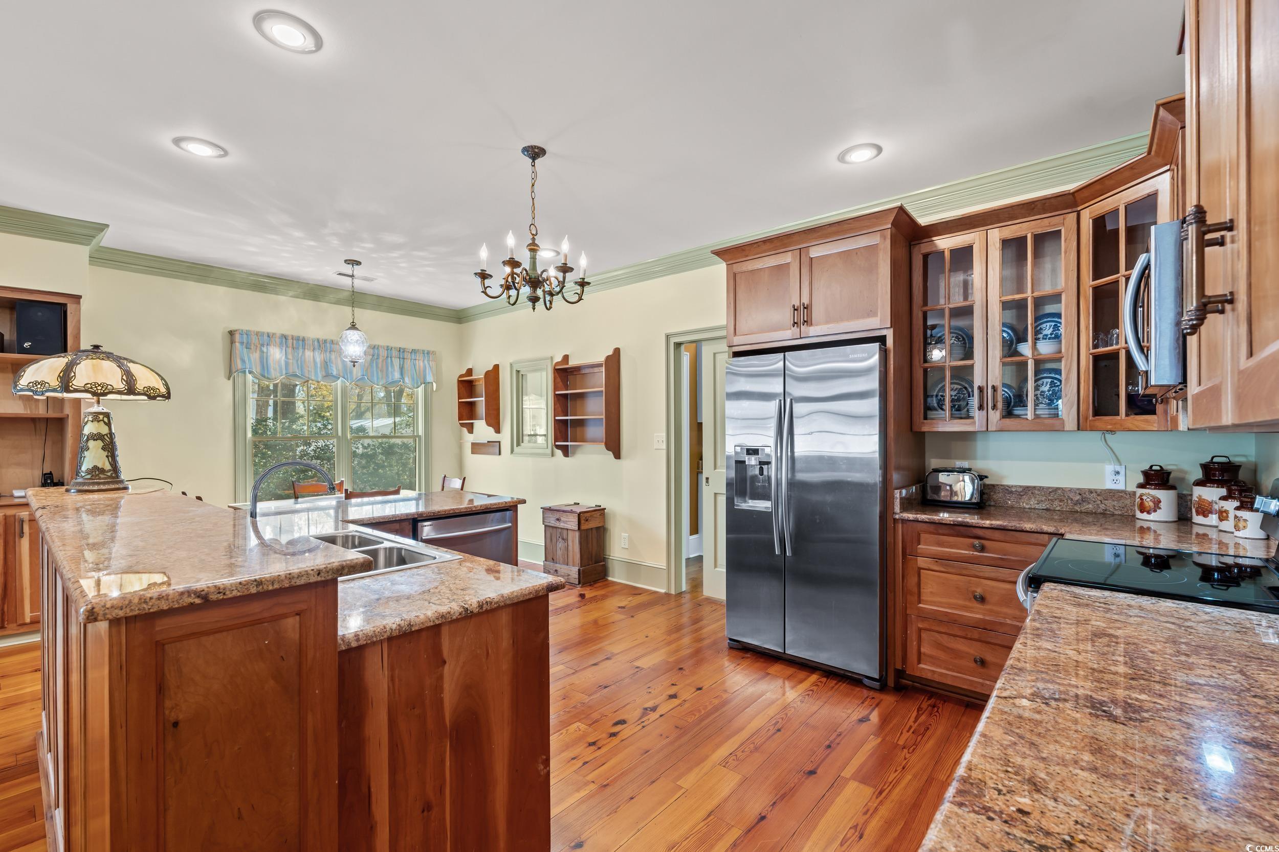 246 County Rd S-22-656 Murrells Inlet, SC 29576 - Photo 6 of 39 Kitchen with crown molding, granite countertops, s