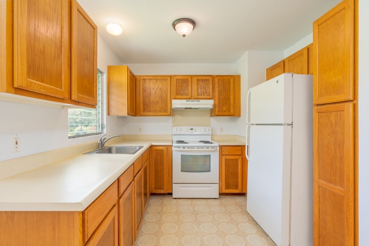 6363 A Puupilo Road Kapaa, HI 96746 - Photo 4 of 19 a kitchen with stainless steel appliances granite countertop a refrigerator a sink dishwasher and a stove