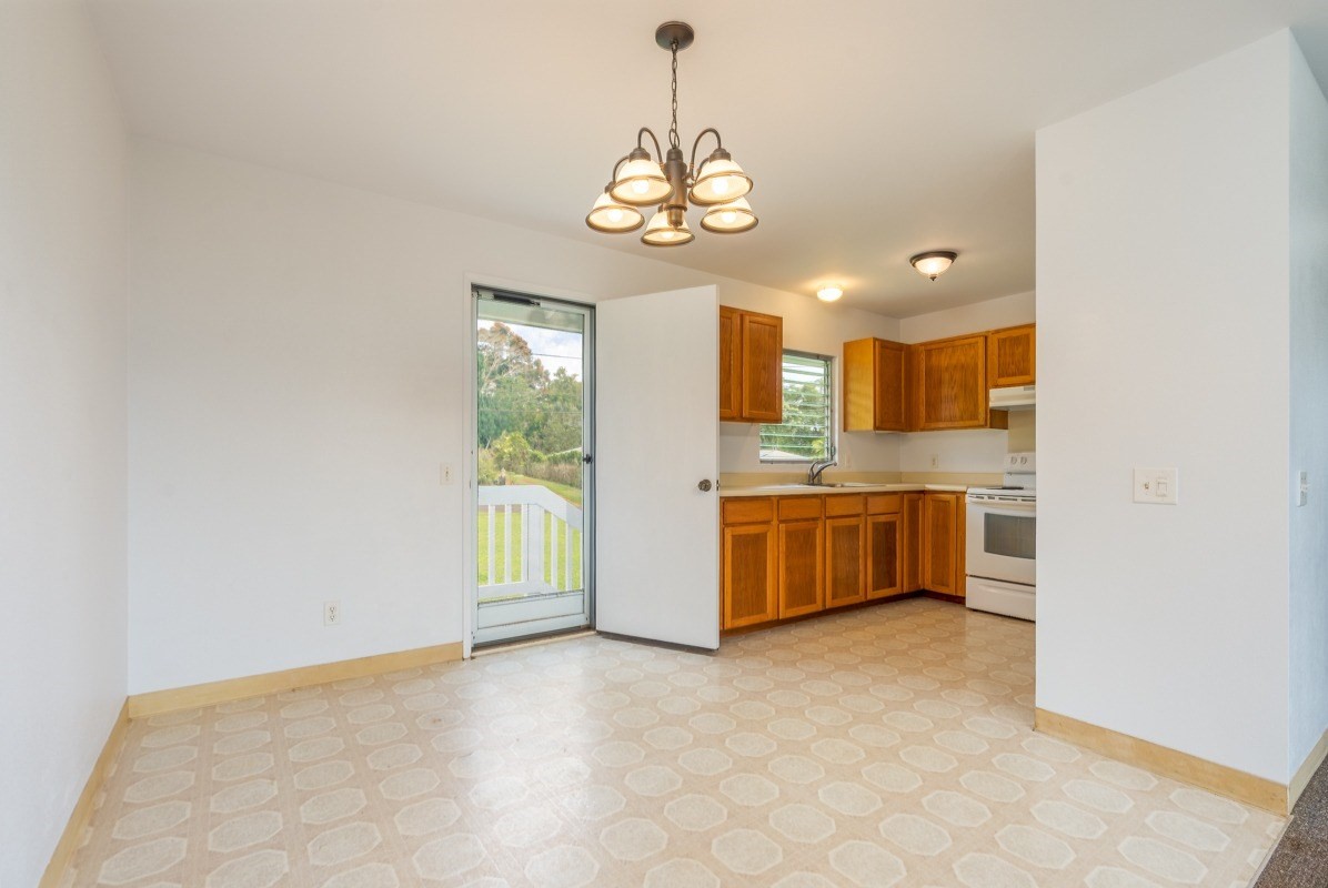 6363 A Puupilo Road Kapaa, HI 96746 - Photo 5 of 19 a large kitchen with a window and stainless steel appliances