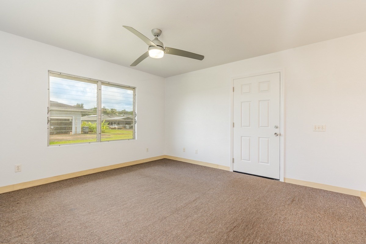 6363 A Puupilo Road Kapaa, HI 96746 - Photo 10 of 19 an empty room with windows and fan