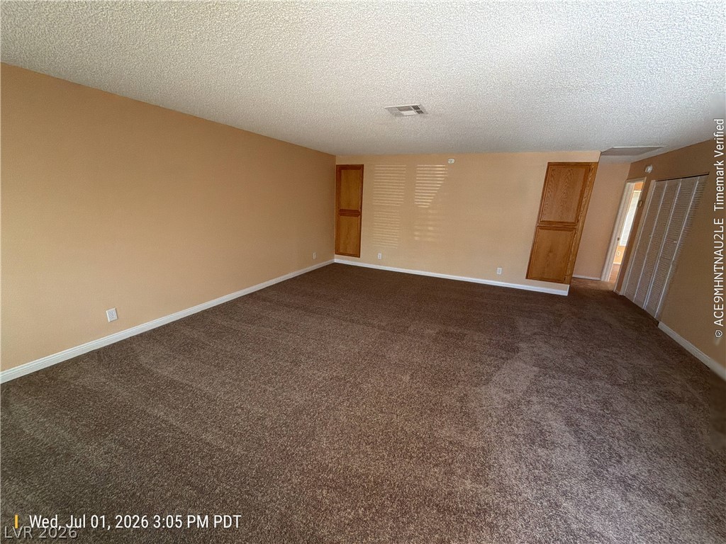 2313 Ragland Street Las Vegas, NV 89108 - Photo 2 of 11 A spacious living area awaits, offering a comfortable and adaptable setting for daily life.