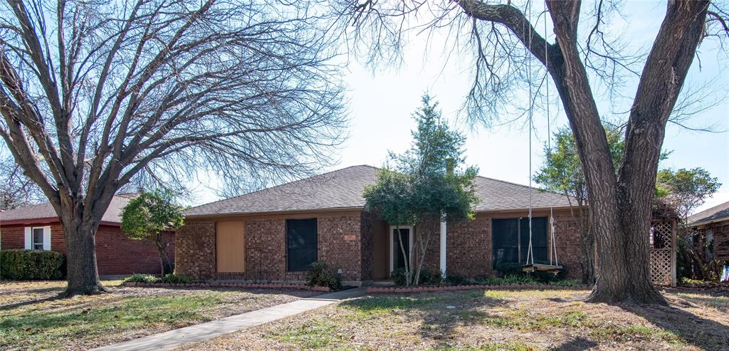 1402 Flameleaf Drive Allen, TX 75002 - Photo 1 of 1 a front view of a house with yard and tree