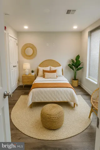 a bedroom with a bed and window