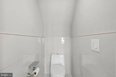 a bathroom with a shower and toilet