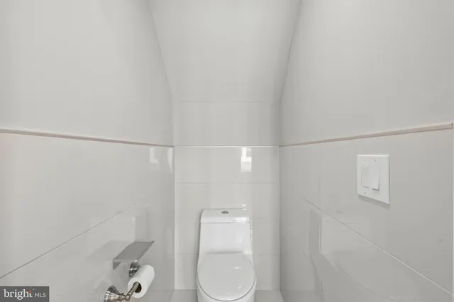 a bathroom with a shower and toilet