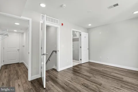 a view of entryway with wooden floor