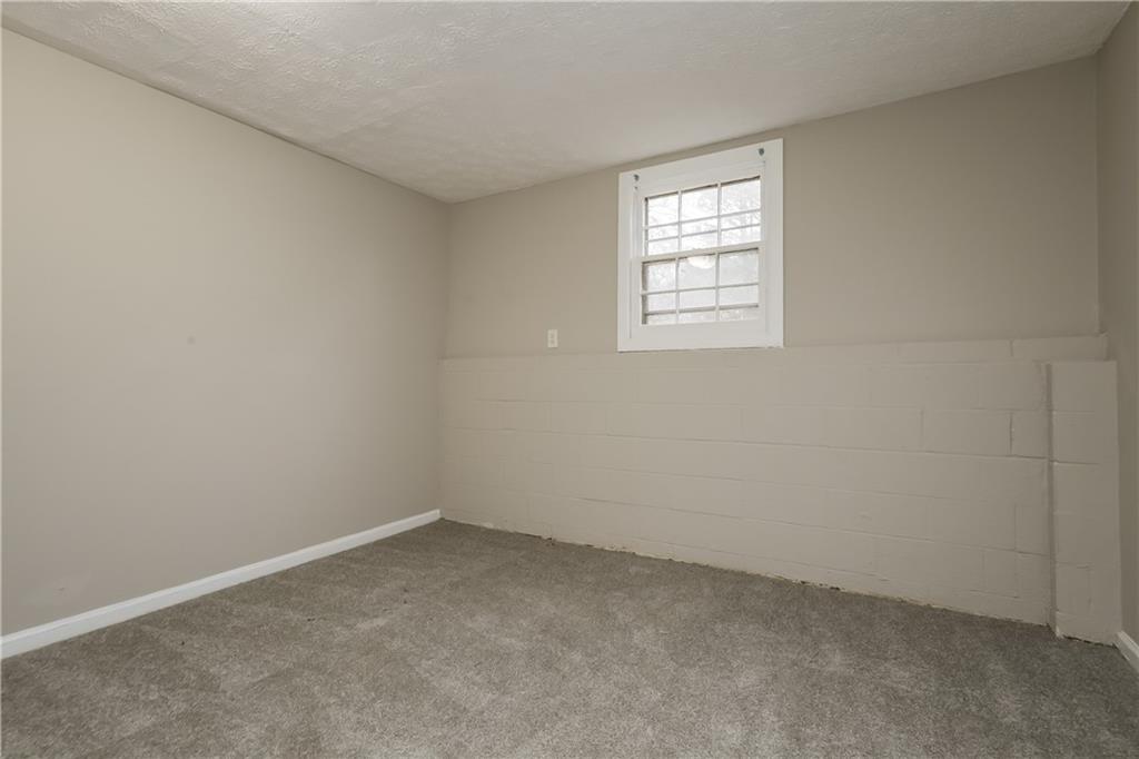 35 Knights Circle Covington, GA 30016 - Photo 13 of 28 an empty room with a window