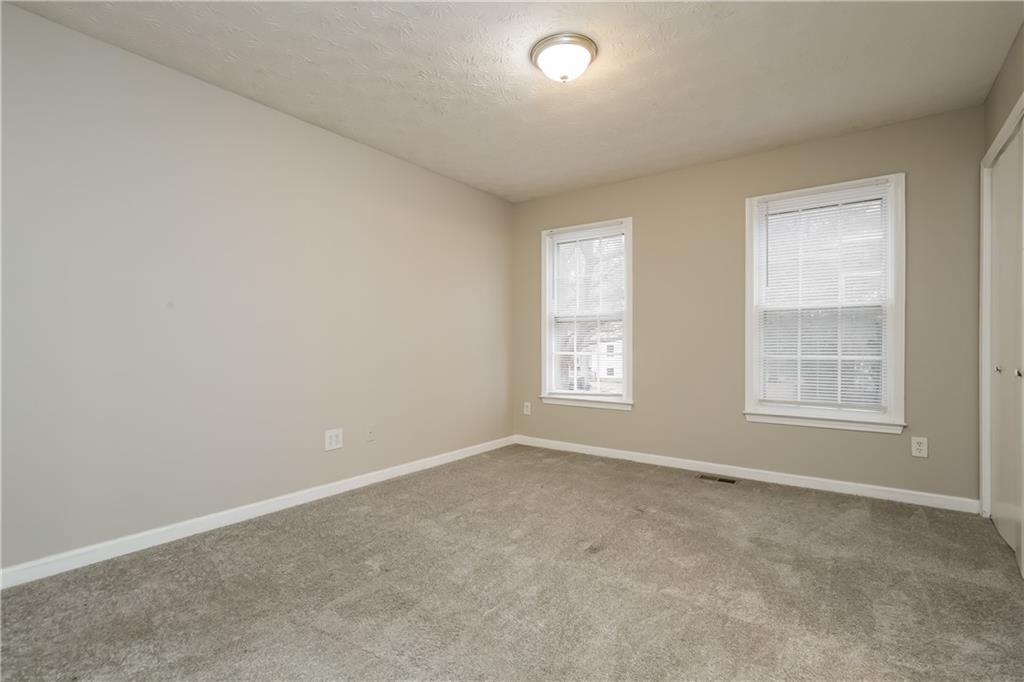 35 Knights Circle Covington, GA 30016 - Photo 16 of 28 an empty room with windows